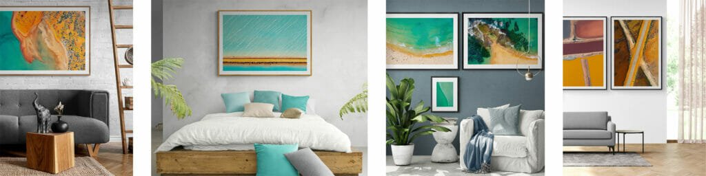 "Four images displaying modern living rooms each styled with vibrant wall art. From left to right: 1) A cozy sitting area with a gray sofa, rustic wooden side table, and a large abstract painting featuring swirling orange and blue tones. 2) A minimalist bedroom with a large bed covered in teal and white linens, complemented by a bright seascape painting above the bed. 3) A stylish lounge with a plush gray sofa, several green houseplants, and a collection of wall-mounted ocean photography. 4) A contemporary living room with a sleek gray sofa, wood accents, and a wall decorated with three abstract paintings in earthy orange and yellow hues.