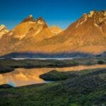Sunrise over Torres del Paine mountains reflected in lake