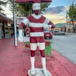Red and white Selk'nam spirit statue