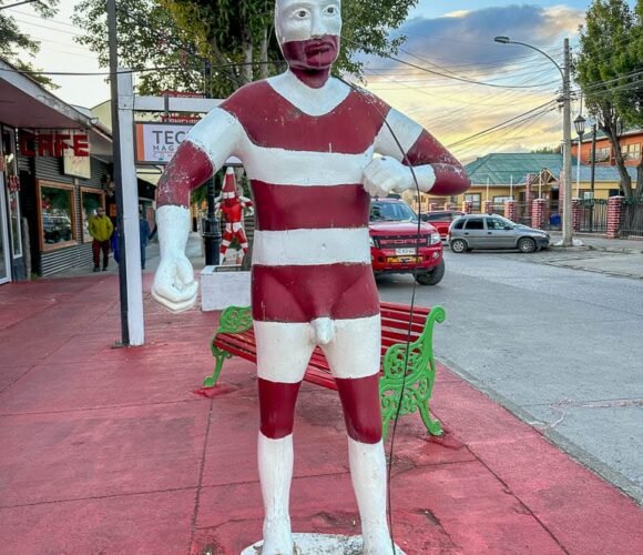 Red and white Selk'nam spirit statue