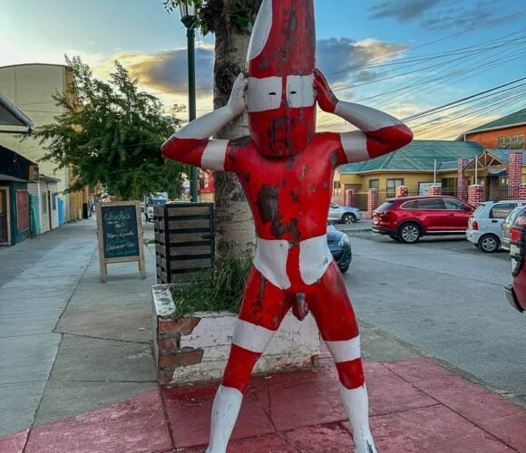 Red and white Selk'nam spirit statue