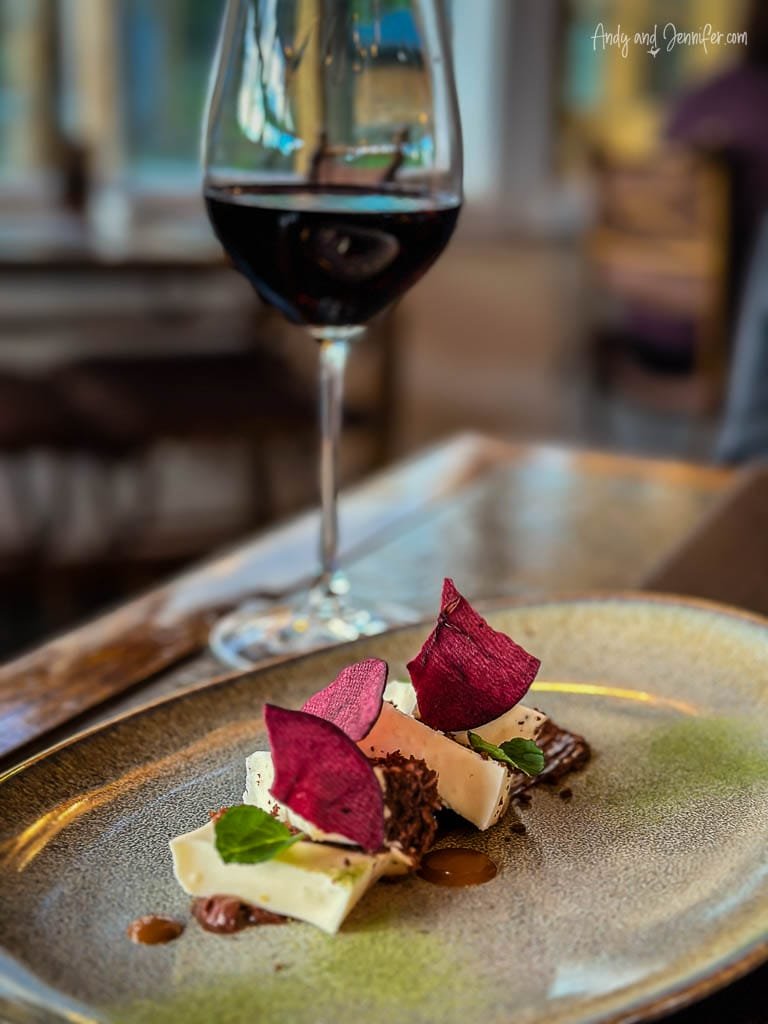 Gourmet dessert with wine glass on elegant table