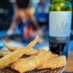 Fried dough served with red wine