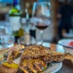 Roast lamb served with red wine