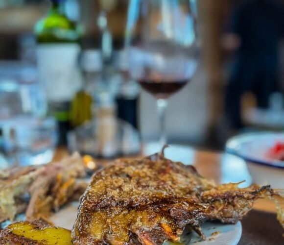 Roast lamb served with red wine