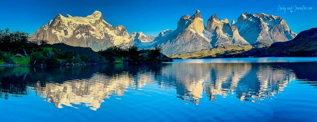 Torres del Paine mountains reflecting in a calm lake