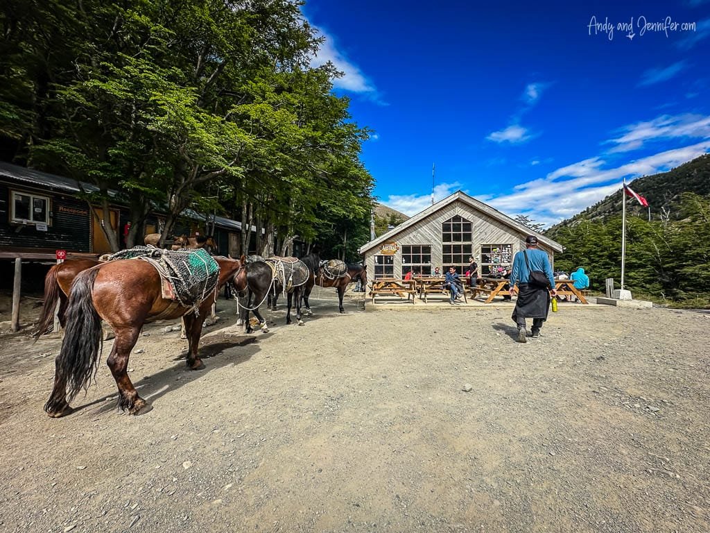 Horses resting outside a rustic Chileno Refugio in the mountains