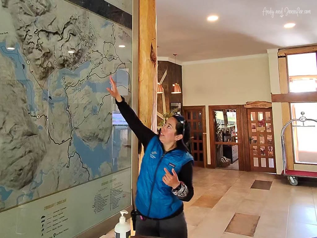 Guide explaining large topographic map indoors