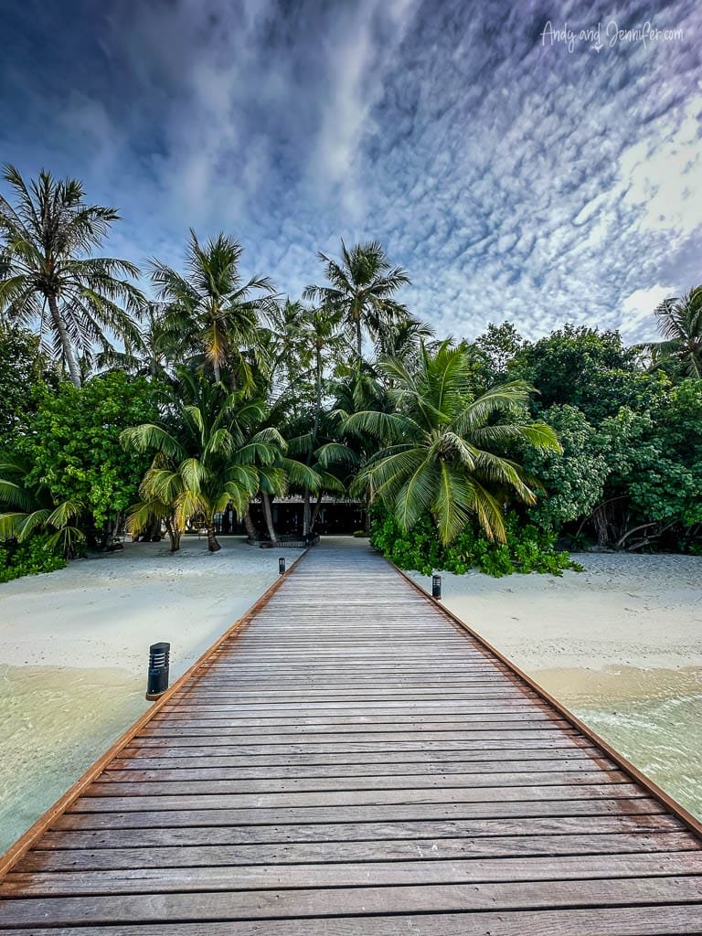 Wooden boardwalk leading to Vilemendhoo Island Resort - one of the best places for snorkelling with whale sharks