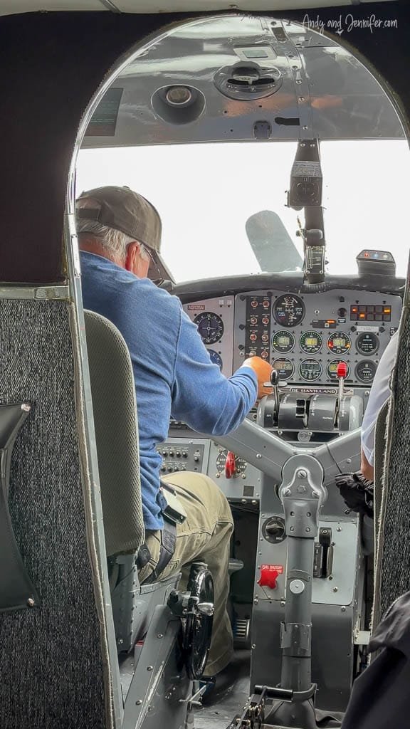 Pilot operating controls in small aircraft cockpit