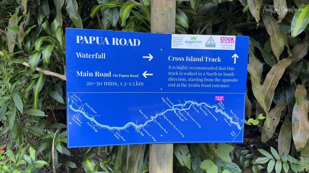 Signage at the start of the Cross Island Track in Rarotonga, providing directions and emphasizing the recommended north-to-south route.