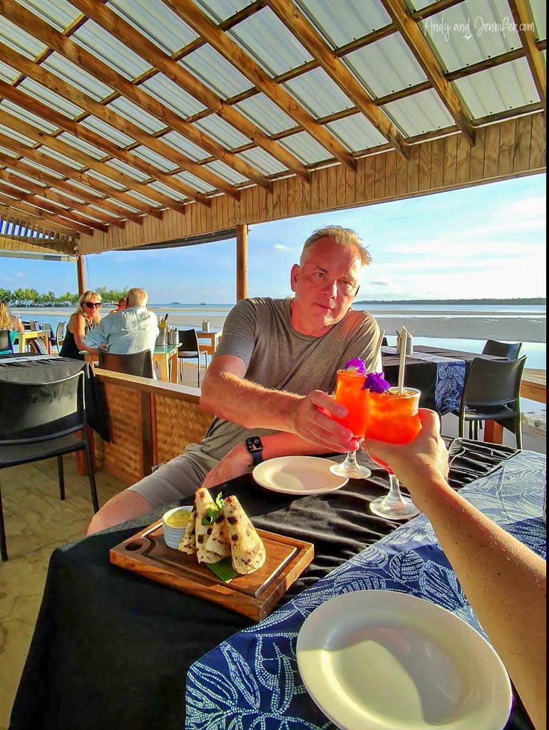 Sharing drinks and appetizers at sunset in the open-air dining area of the Blue Lagoon Restaurant, Rarotonga