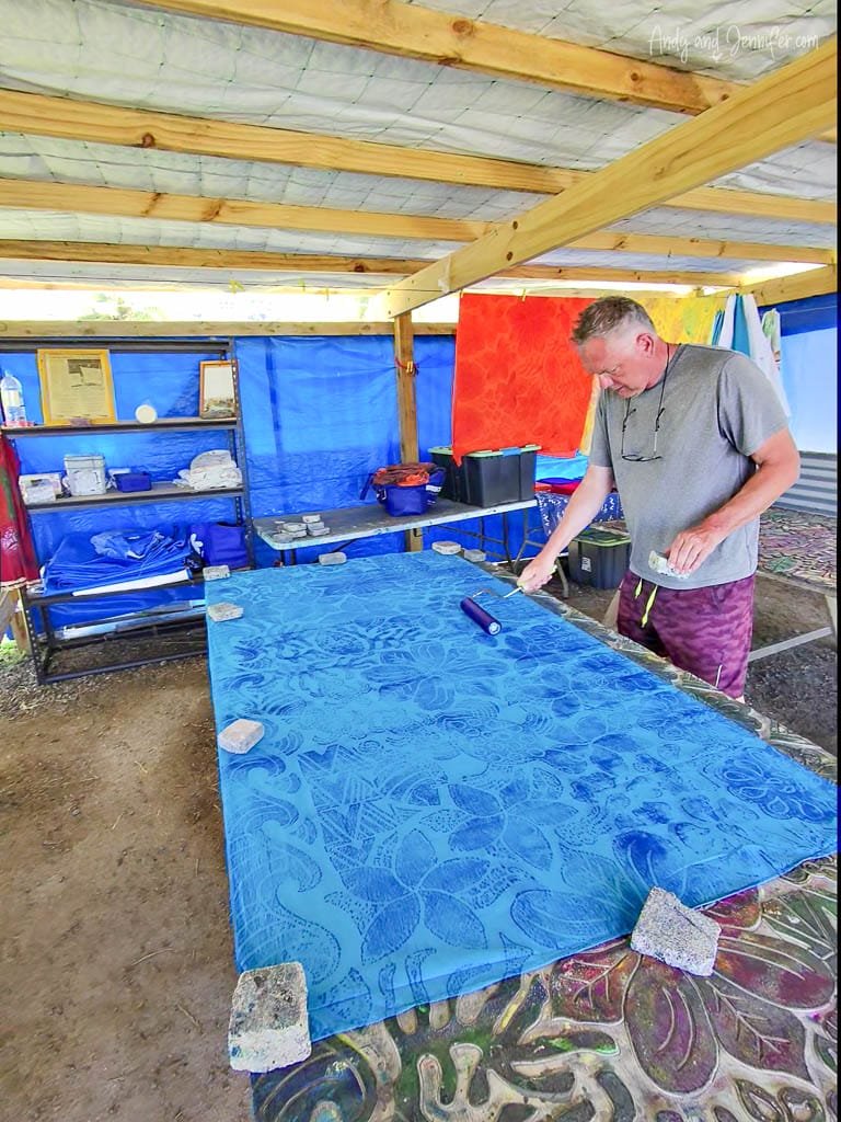 Block printing a traditional pattern onto fabric during a hands-on session at Tie Dye Rarotonga.