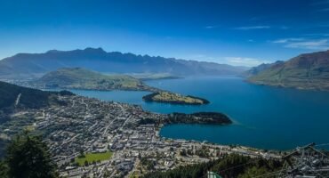 Scenic aerial view of Queenstown with lake and mountain backdrop