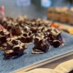 Chocolate nut clusters dusted with powdered sugar