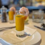 Shrimp on glass of pumpkin soup appetizer
