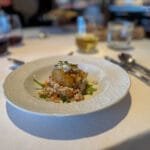 Farro salad topped with roasted vegetables