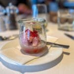 Strawberry sorbet in glass jar with spoon