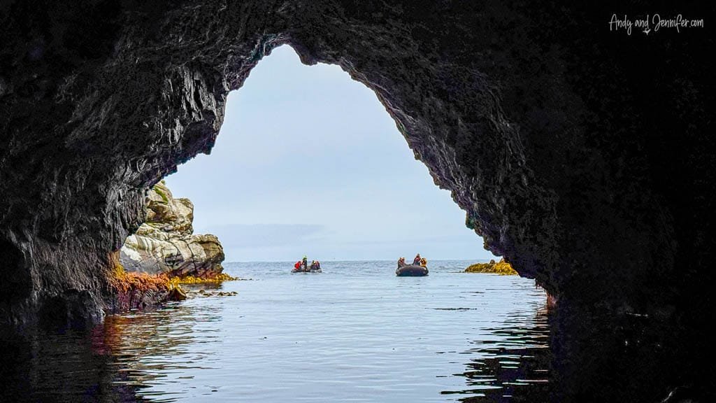 Inflatable boats viewed from sea cave entrance
