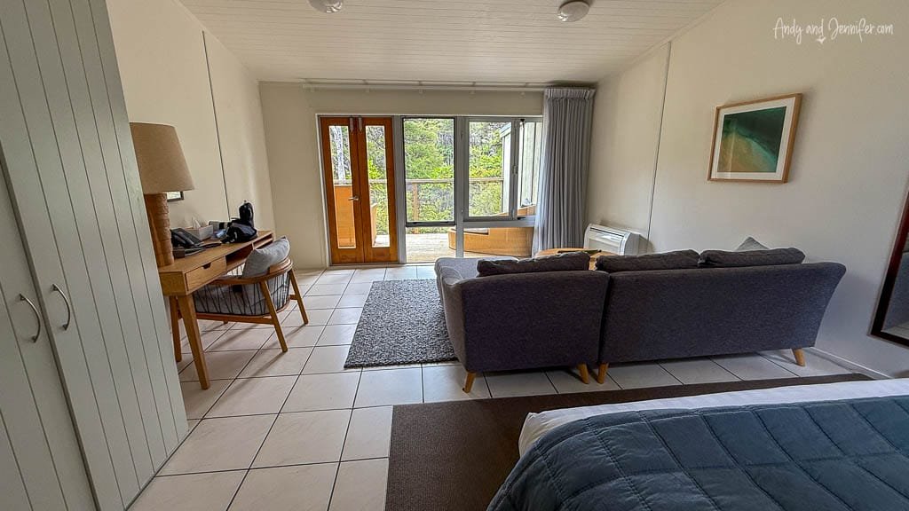 Bright lodge room with sofa and balcony view