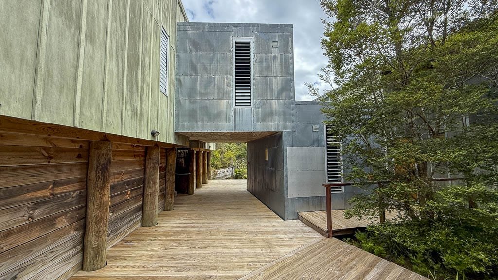 Modern lodge walkway with wood and metal siding