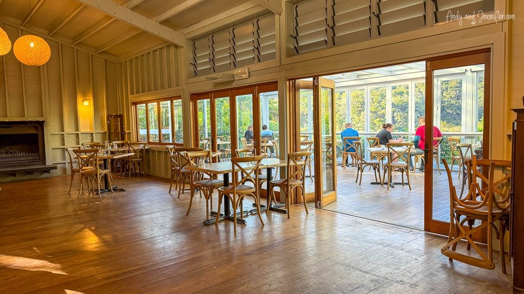 Indoor-outdoor dining area with wood tables
