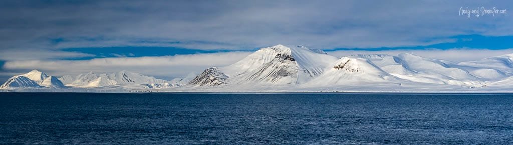 Svalbard landscapes feature snow-covered mountains across Arctic ocean