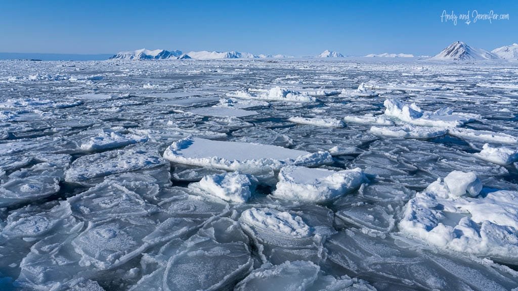 Sea ice broken into slabs under clear Arctic sky