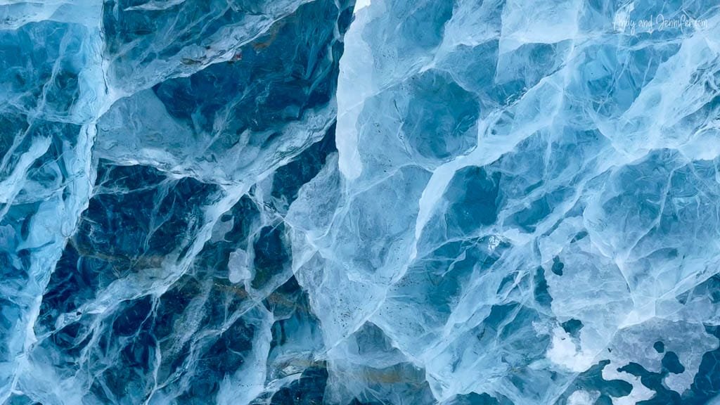 Patterned blue ice with deep glacier cracks