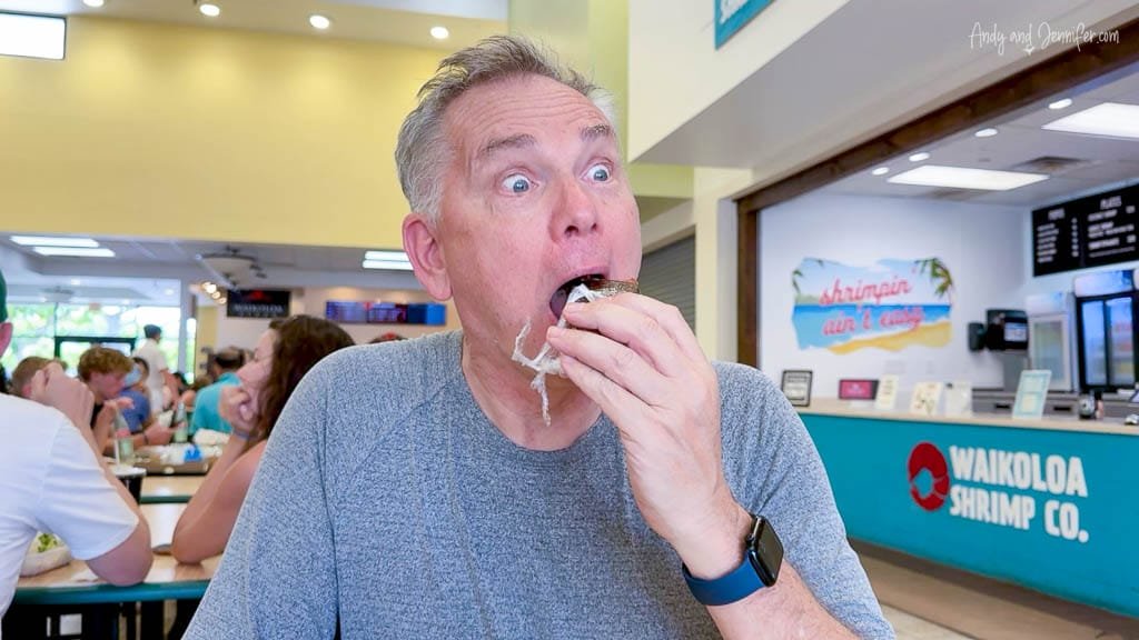 Man eating spam musubi at L&L BBQ restaurant