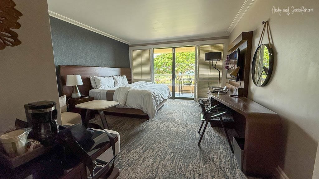 Modern hotel room with balcony and king bed