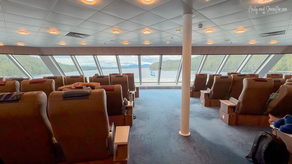 Scenic ferry lounge with ocean view windows.