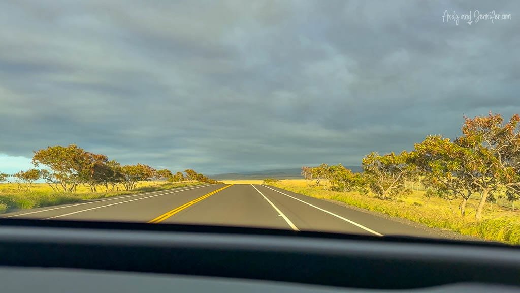 Scenic highway drive under dark cloudy sky