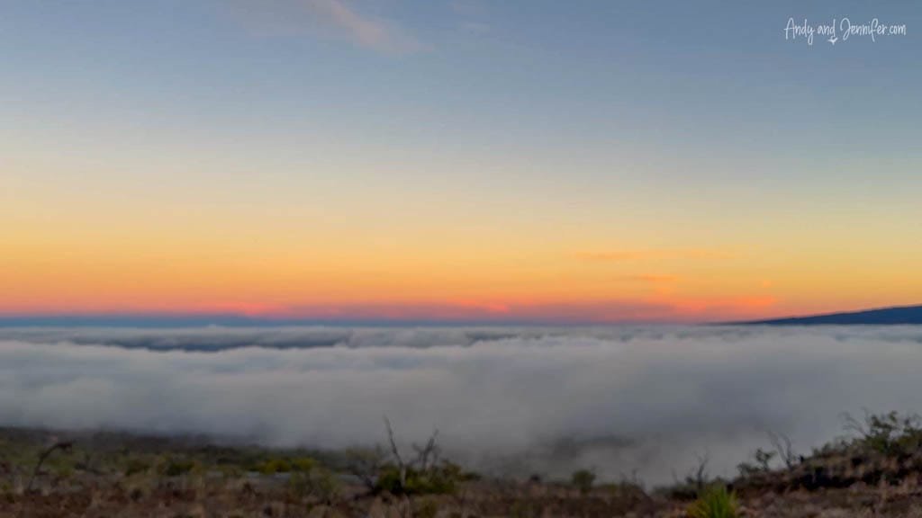 Sunset above clouds from mountain viewpoint