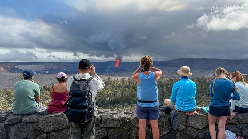 Tourists watching lava eruption at volcano lookout