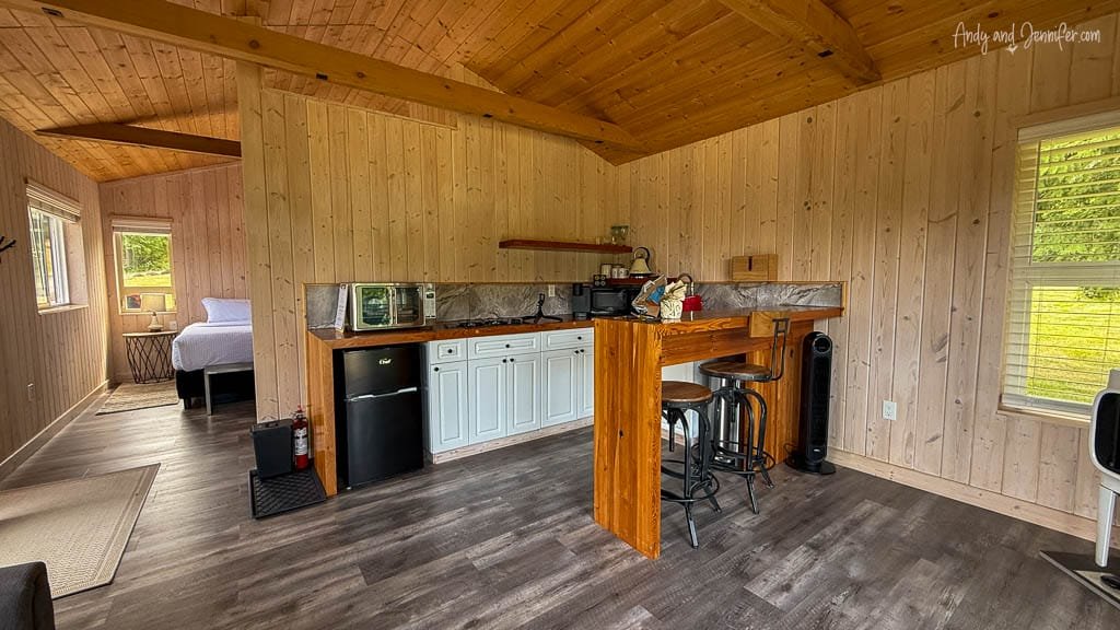 Small cabin kitchen with dining bar and wood accents