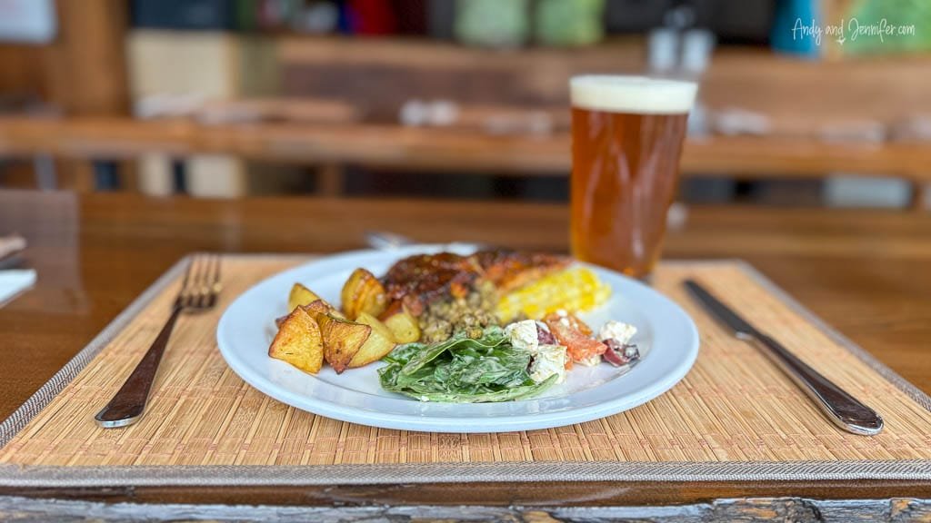 Plated dinner with roasted potatoes and beer