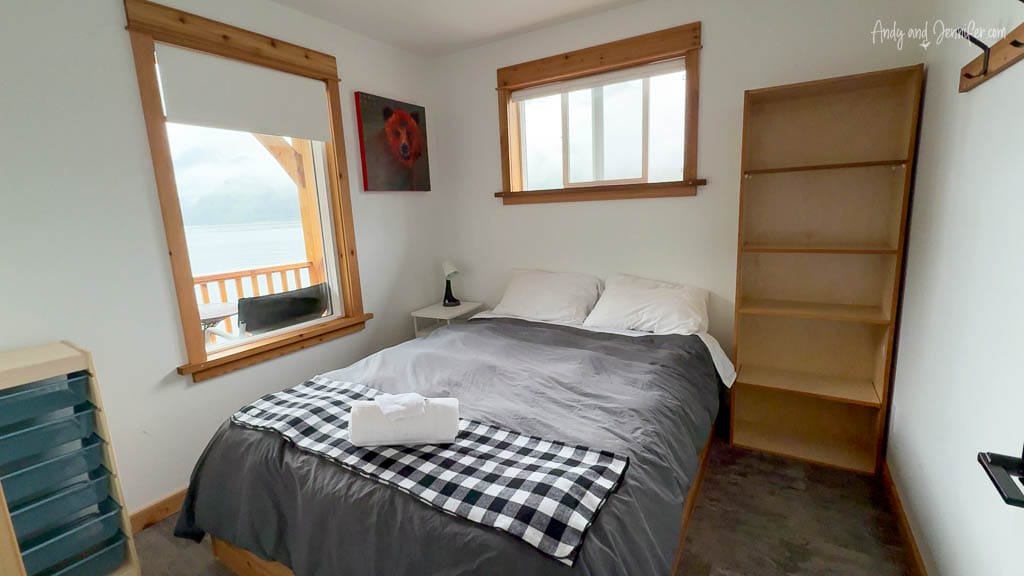 Cozy bedroom with lake view and wood accents