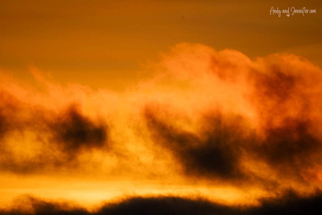 Dramatic orange sky with clouds glowing at sunset in Antarctica