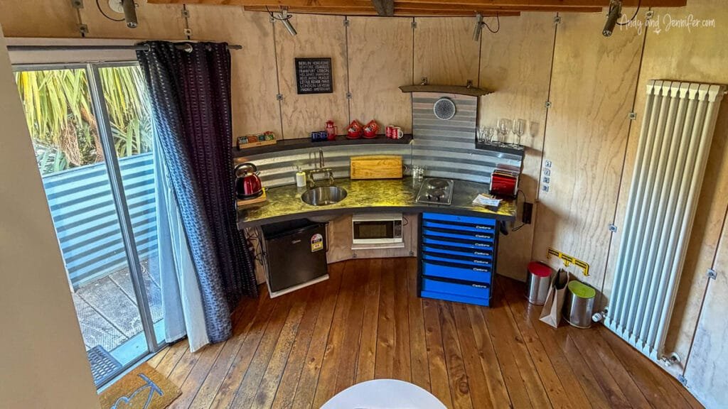 Compact kitchen inside a converted grain silo at Silostay, Banks Peninsula