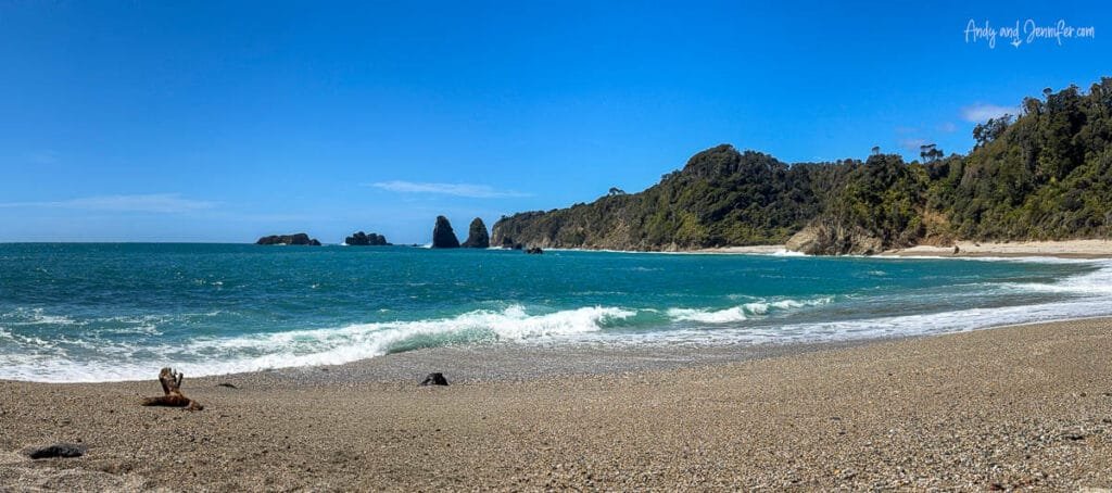 Wide sandy beach and turquoise water on West Coast near Lake Moeraki, New Zealand
