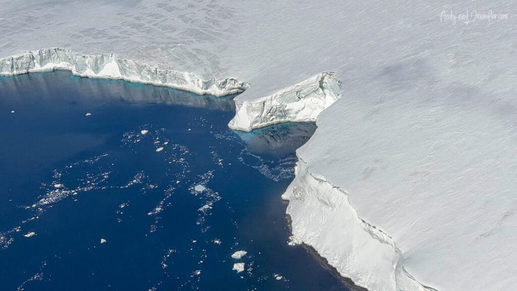 Ice shelf edge and open water seen from above during Antarctic helicopter flight