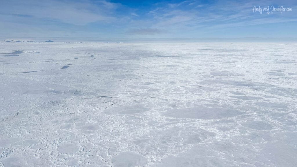 Wide aerial view of snow-covered sea ice and pressure ridges in Antarctica
