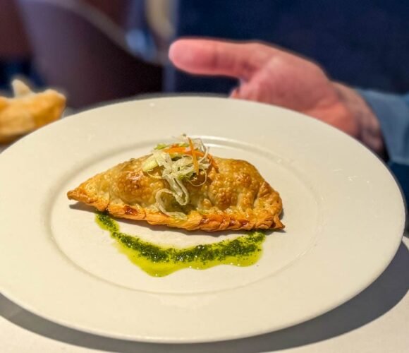 Savory pastry appetizer served aboard the Ultramarine during an Antarctica expedition cruise crossing the Drake Passage