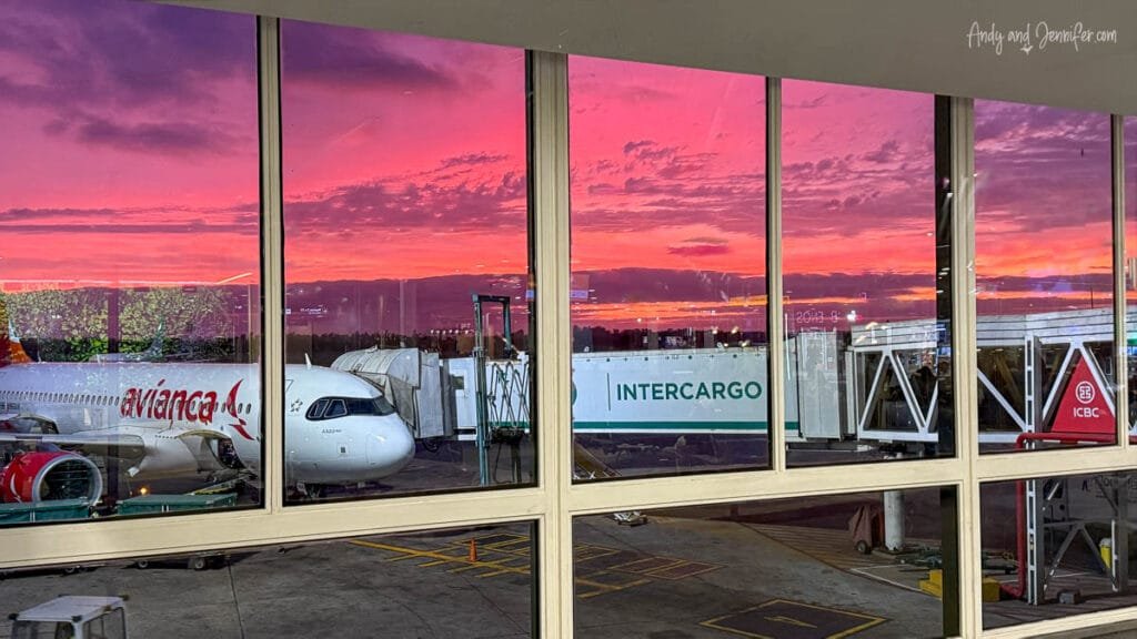 Sunrise over Buenos Aires airport viewed through the terminal windows beside an Avianca aircraft before our flight to Panama via Quito