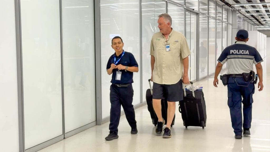 Andy retrieving our lost luggage from restricted airport corridors in Panama after our bags were stranded in Quito during our journey from Antarctica to Canopy Tower