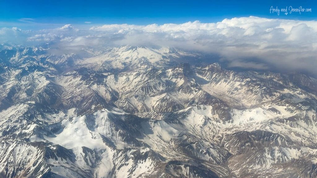 Snow-covered Andes range seen from airplane window between Santiago and Buenos Aires