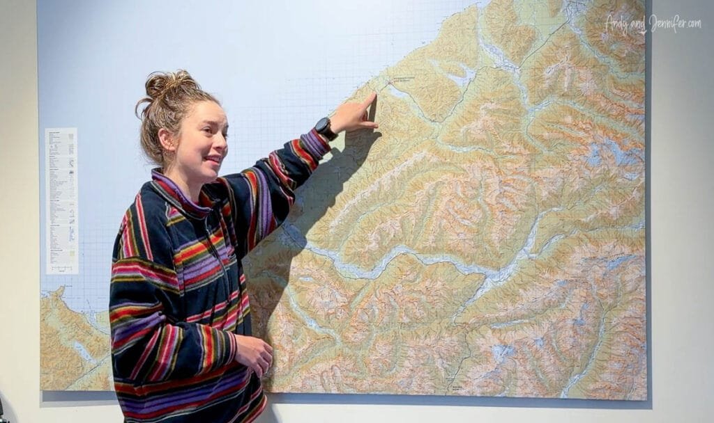 Lodge guide explaining local map and routes at Lake Moeraki Wilderness Lodge