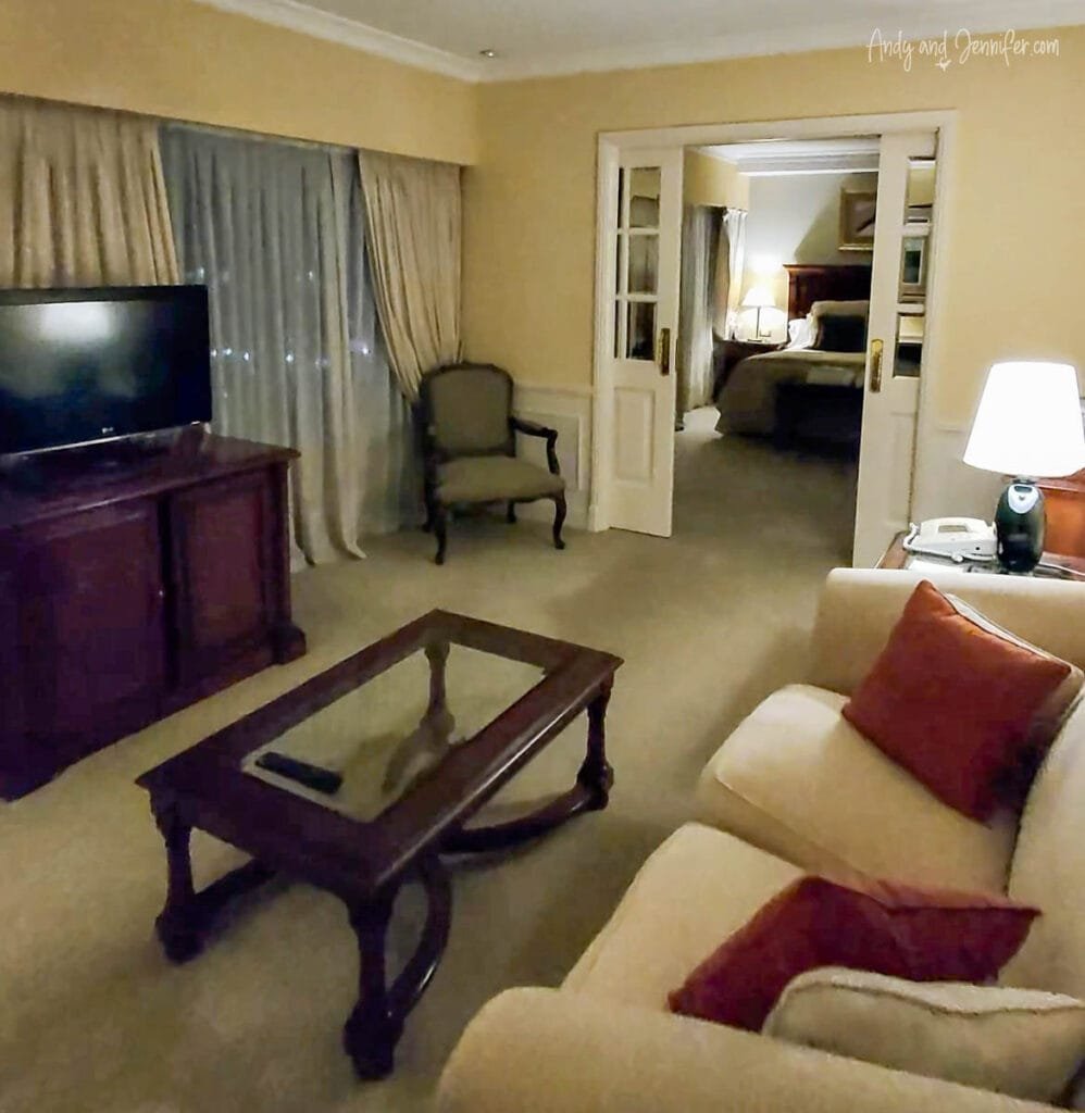 Spacious suite with living area and bedroom at Hotel Emperador Buenos Aires