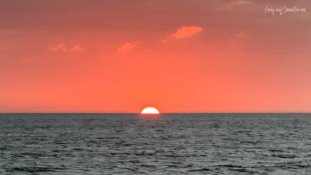Sunset over the Pacific Ocean after crossing the equator in the Galápagos Islands.